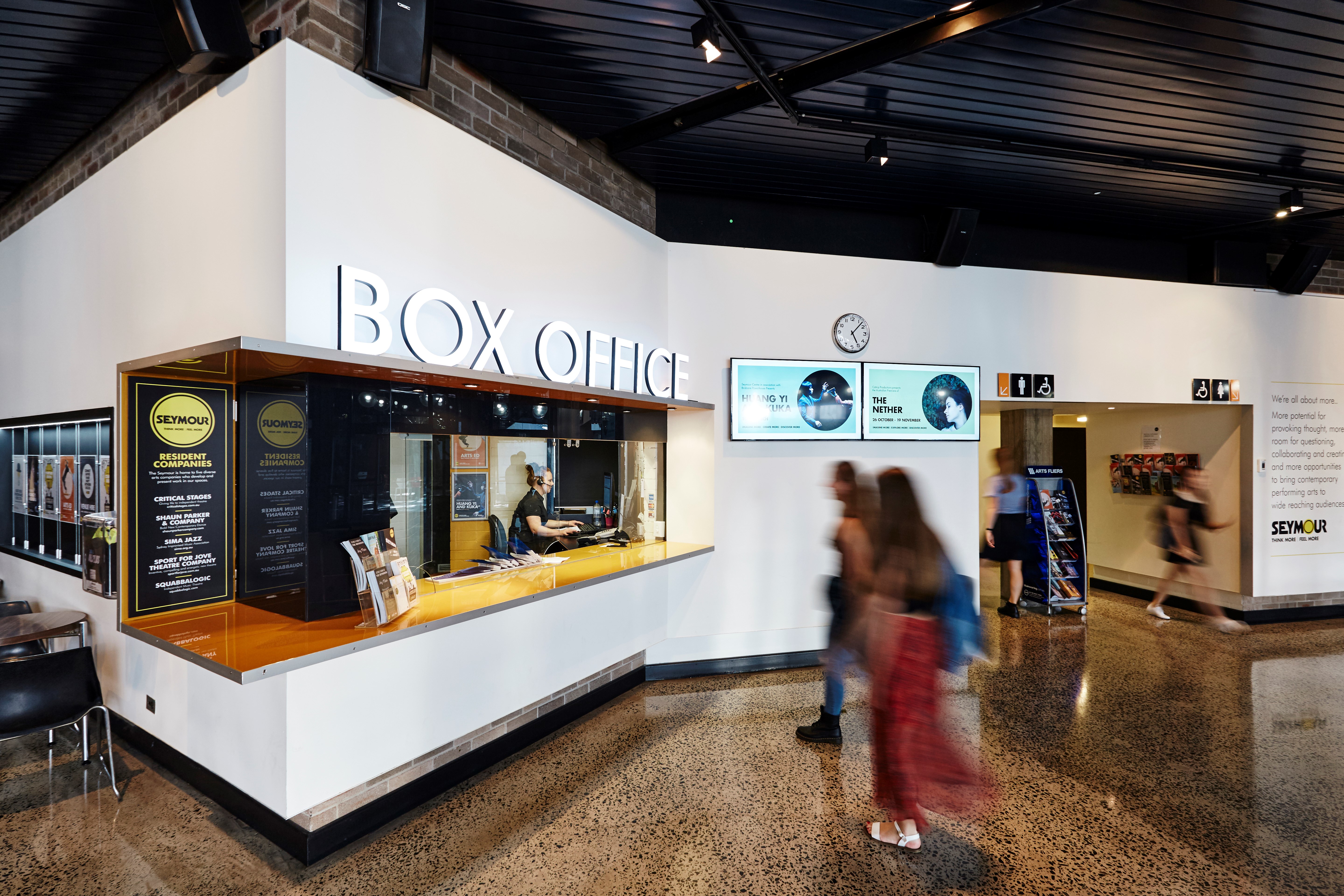 Image of Seymour Centre Box Office with people walking in front. 