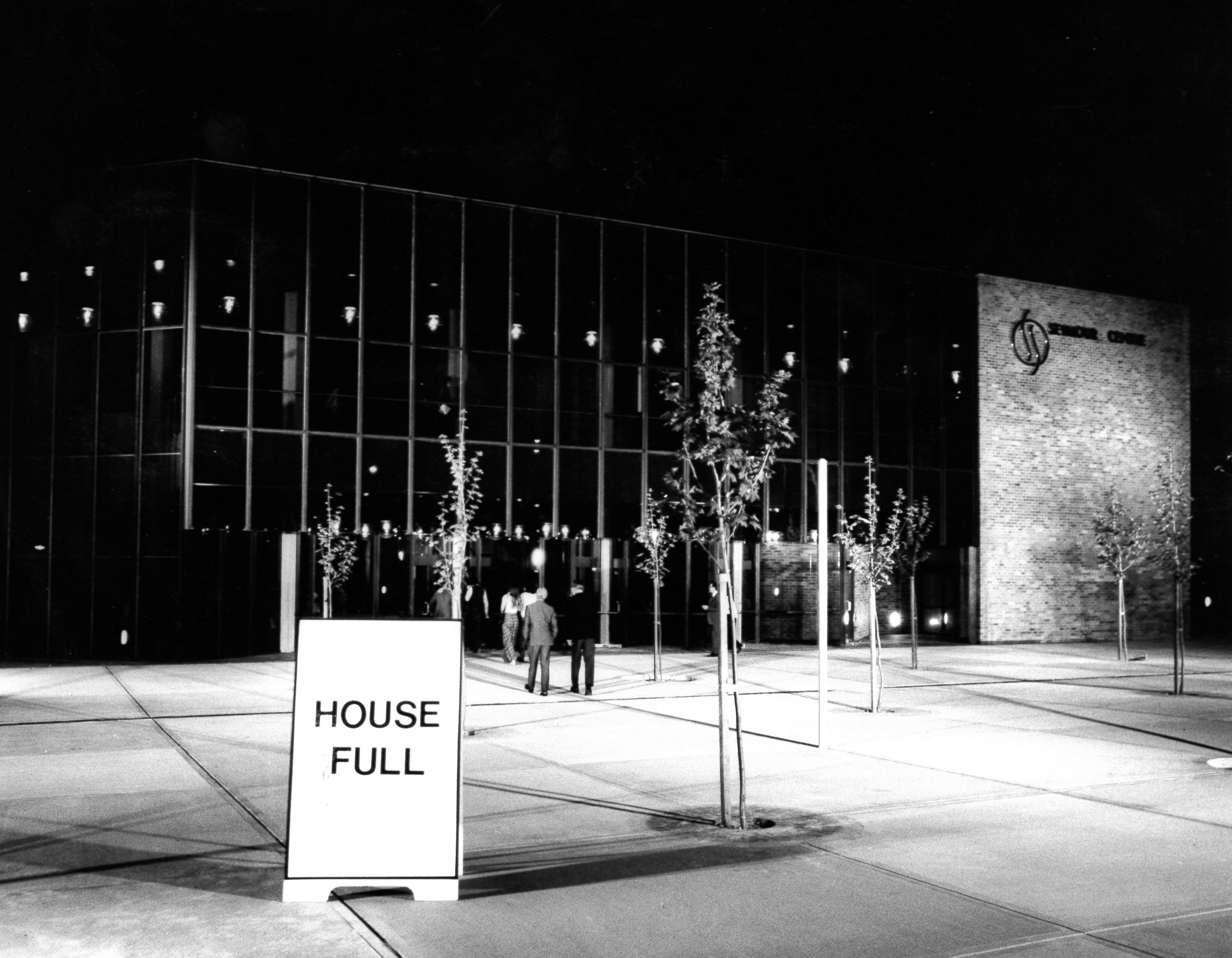 Black and white archival image of Seymour Centre front entrance with a House Full sign displayed.