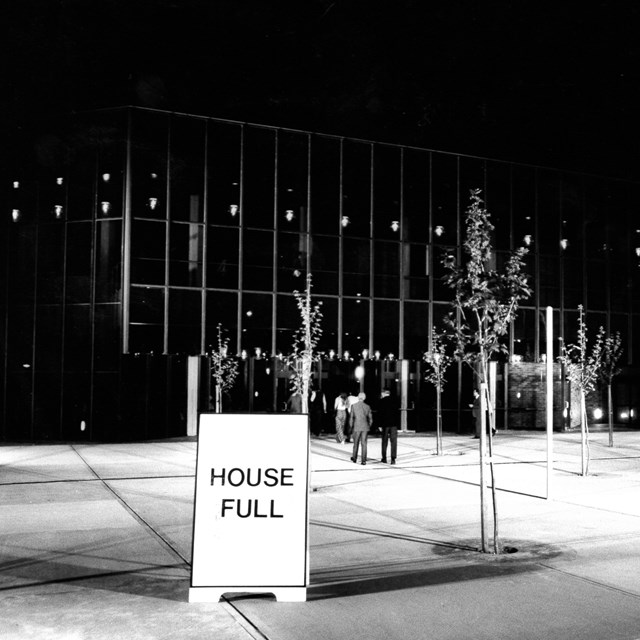 Black and white archival image of Seymour Centre front entrance with a House Full sign displayed.