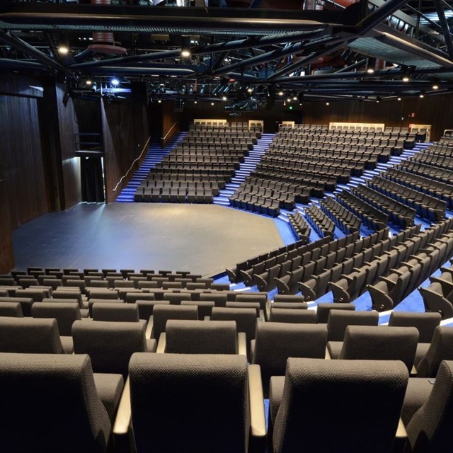 Empty York Theatre seating bank viewed from the side. 